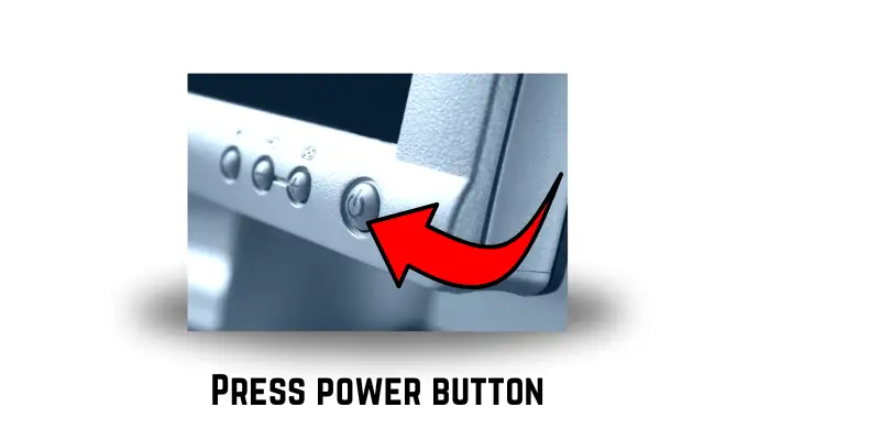 A front view of a computer with a red arrow pointing to the power button.