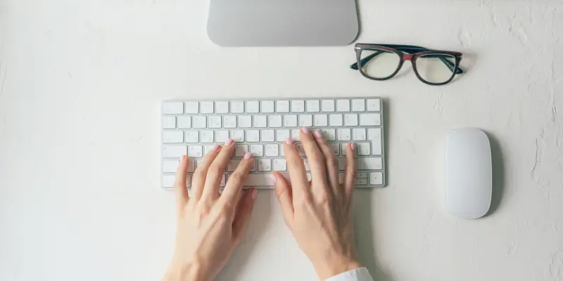 keyboard typing Hands typing on white computer keyboard