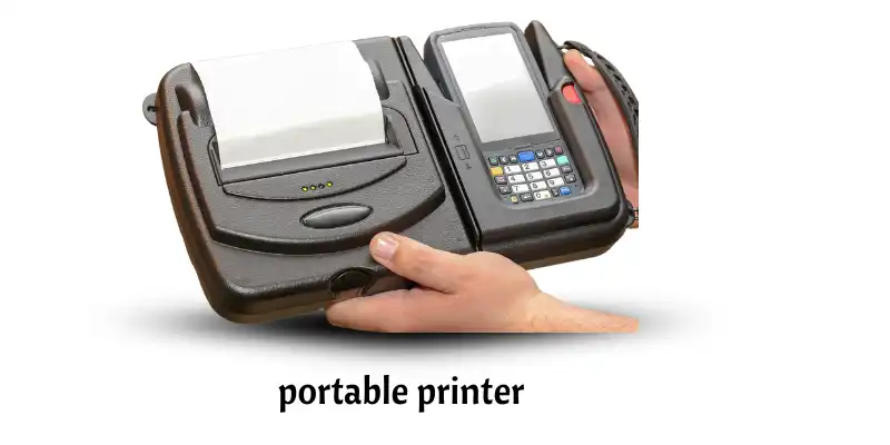 A portable printer is being held in hand with a printed page coming out.