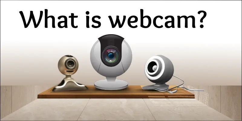 Three different types of webcams placed on a wooden surface with the text “What is webcam?” displayed above.